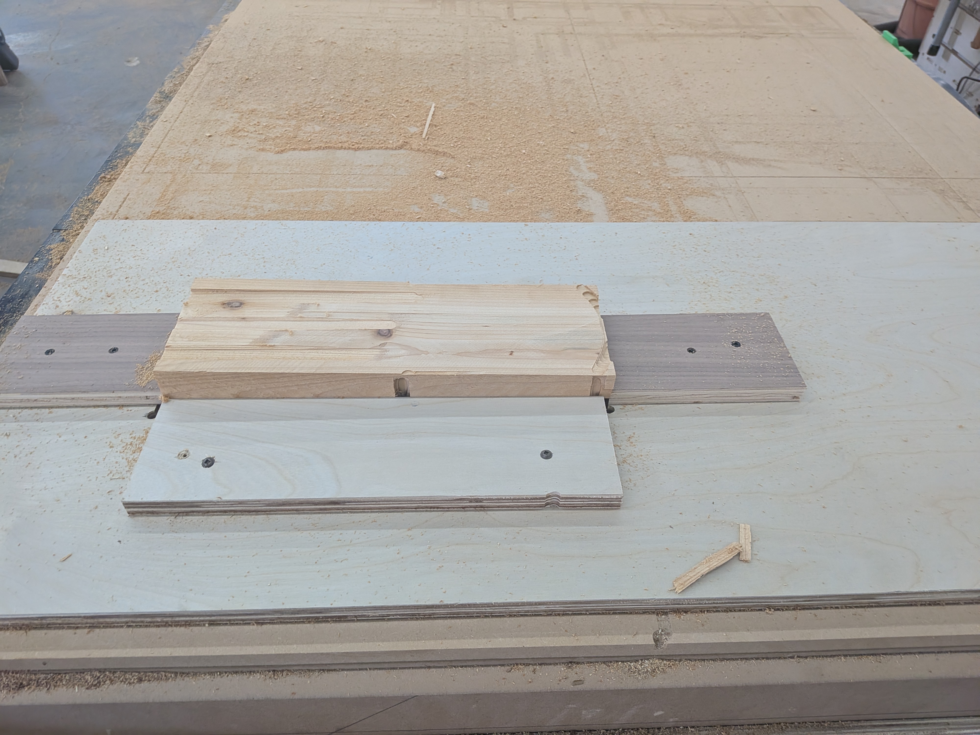 Track-based workholding system on the CNC table